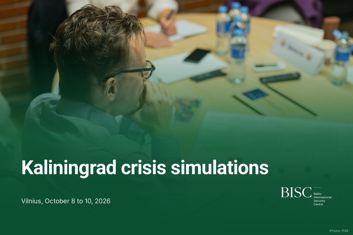 A participant studies a printed map of the Kaliningrad region with wooden counters at the simulation table, under a dark green fade. Text: Kaliningrad crisis simulations. Vilnius, October 8 to 10, 2026. BISC logo. Photo: ISM.