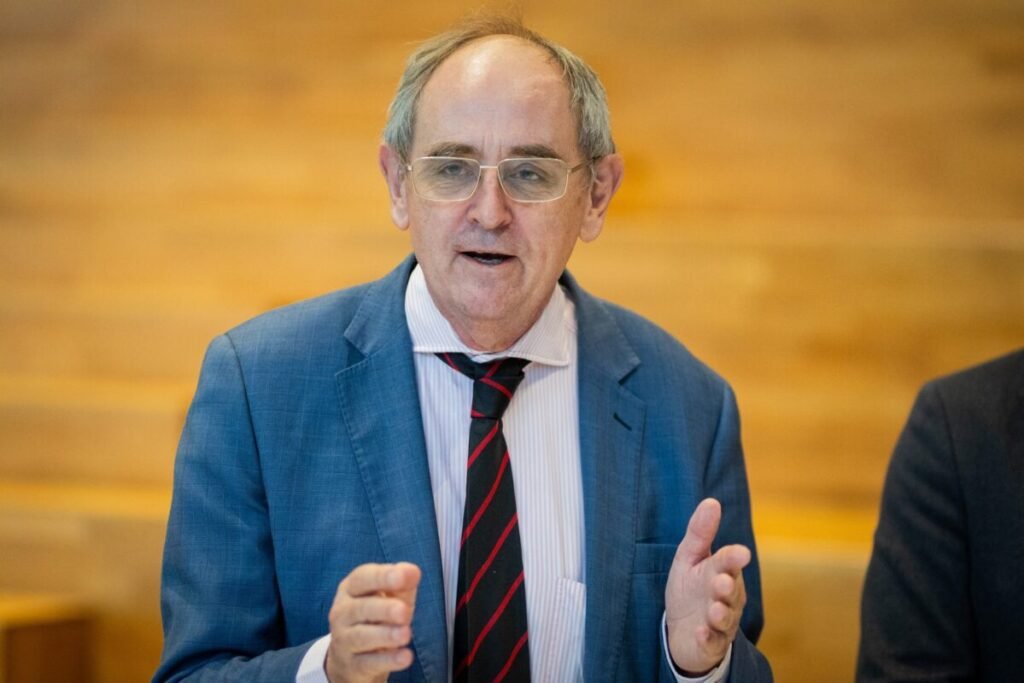 Edward Lucas, BISC’s founder-director, speaks and gestures at the press conference at ISM University.