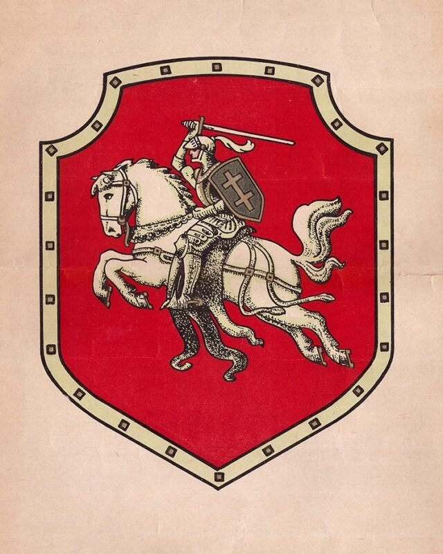 Vytis: a knight with a raised sword on a rearing white horse, on a red shield with a light riveted border.